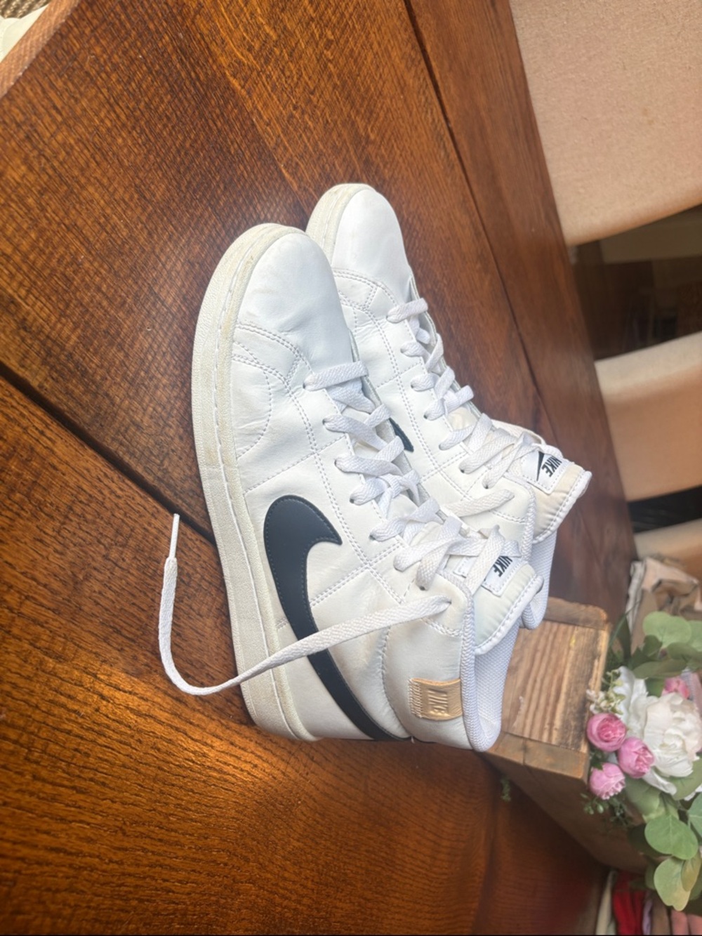 Nike White High-Top Sneakers with Black Swoosh